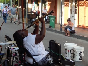 Woman playing clarinet with great passion on the street in the French Quarter of New Orleans